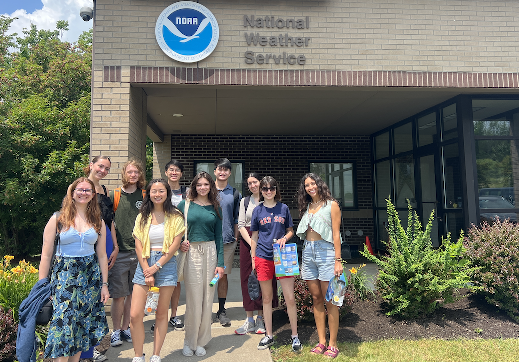 Students from the CorGGLE program stand at the entrance to the Binghamton, NY offices of the National Weather Service during a summer, 2024 field trip.